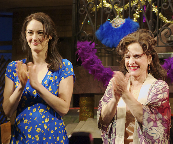 Helen Cespedes and Patti LuPone share a curtain call.