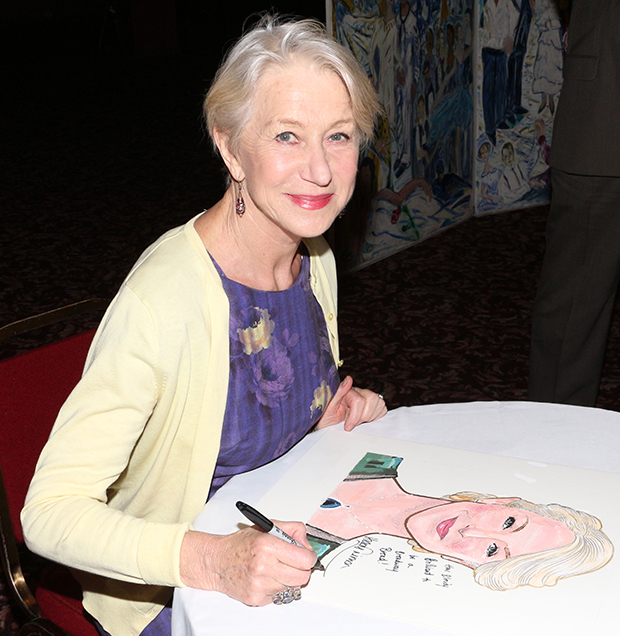 Helen Mirren autographs the caricature that will hang on the walls of Sardi&#39;s.