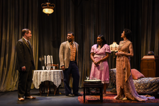 Doug Harris as Jim, Richard Prioleau as Tom, Olivia Washington as Laura, and Saundra Santiago as Amanda in Tennesse Williams&#39; The Glass Menagerie, directed by Christopher Scott, at the 47th Street Theater.