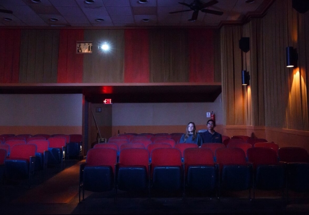 Louisa Krause and Aaron Clifton Moten watch a movie in Annie Baker&#39;s The Flick at Playwrights Horizons.