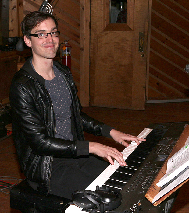 Clinton the Musical writer Paul Hodge sits down at the piano.