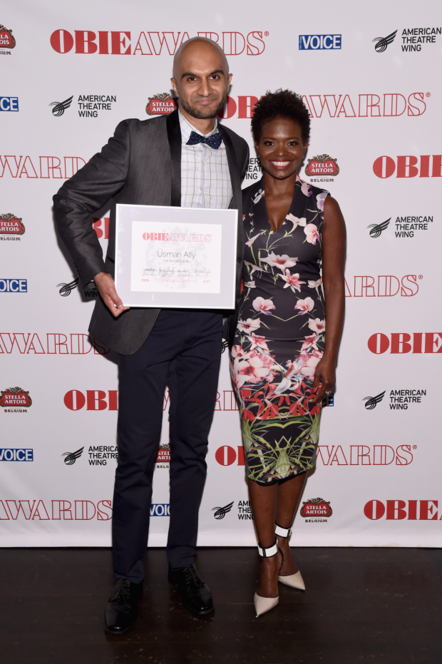 Usman Ally shows off his Obie for The Invisible Hand alongside presenter LaChanze.