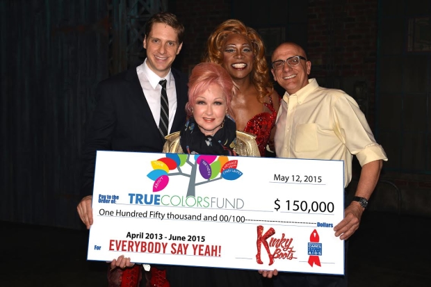 Broadway Cares head honcho Tom Viola (right) joins Kinky Boots stars Andy Kelso and Billy Porter to present Cyndi Lauper and True Colors Fund with a big check.