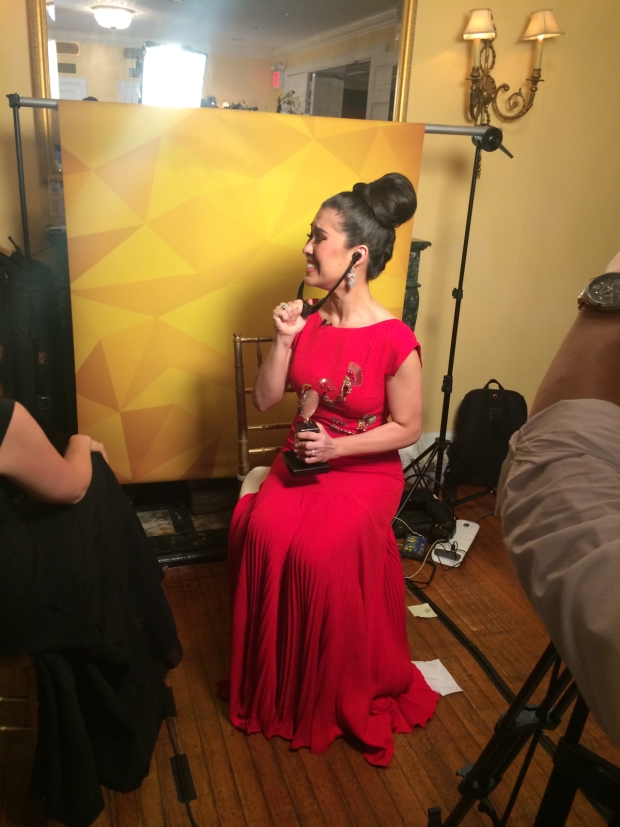 Ruthie Ann Miles listens in the press room as The King and I wins the Tony Award for Best Revival of a Musical.