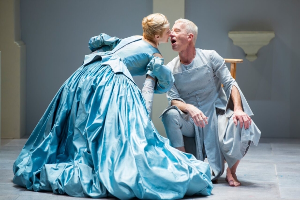 Sofia Jean Gomez as Elmire and Steven Epp as the title character in Molière's Tartuffe, Tartuffe, adapted by David Ball and directed by Dominique Serrand, at Shakespeare Theatre Company.