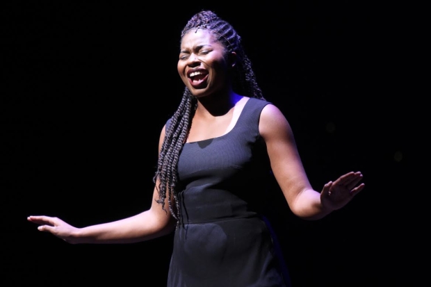 Marla Louissaint sings from Caroline, or Change on stage at the Minskoff Theatre.