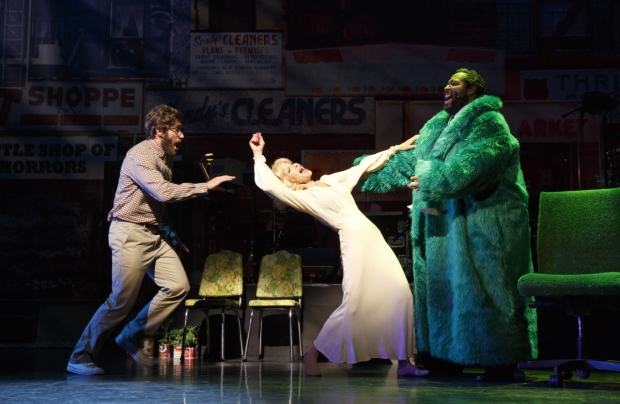 Jake Gyllenhaal as Seymour, Elle Greene as Audrey, and Eddie Cooper as Audrey II in Little Shop of Horrors at New York City Center.