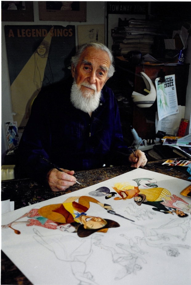 Al Hirschfeld works on a drawing at his desk in 2002, a year before his death.