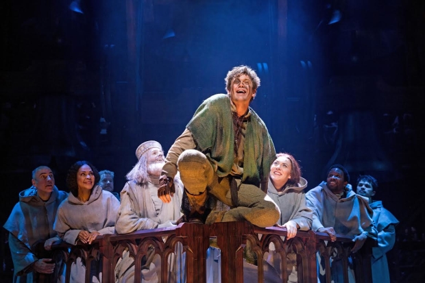 Michael Arden (center) as Quasimodo in the La Jolla Playhouse/Paper Mill Playhouse coproduction of The Hunchback of Notre Dame.