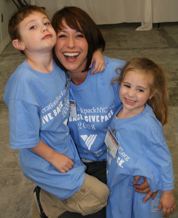 Paige Davis with two young volunteers.