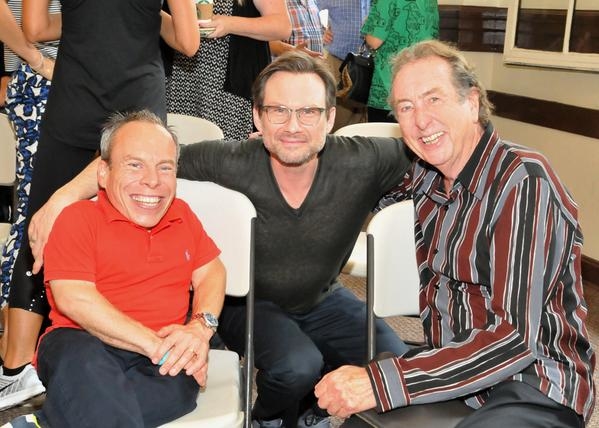 Monty Python original and Spamalot writer Eric Idle (right) poses with his Hollywood Bowl cast members Warwick Davis (left) and Christian Slater (center).