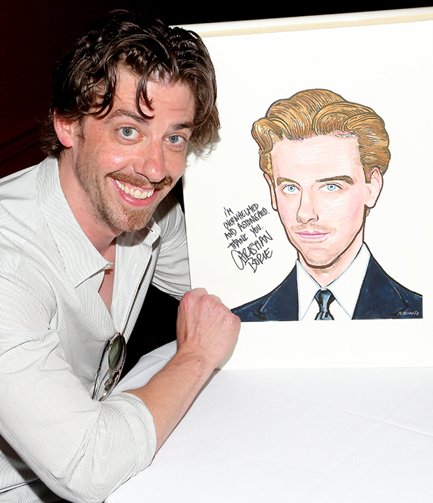 Christian Borle poses with his brand new caricature at Sardi&#39;s.