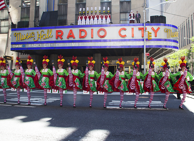 The Radio City Rockettes stop traffic on Sixth Avenue for a Christmas kick line.