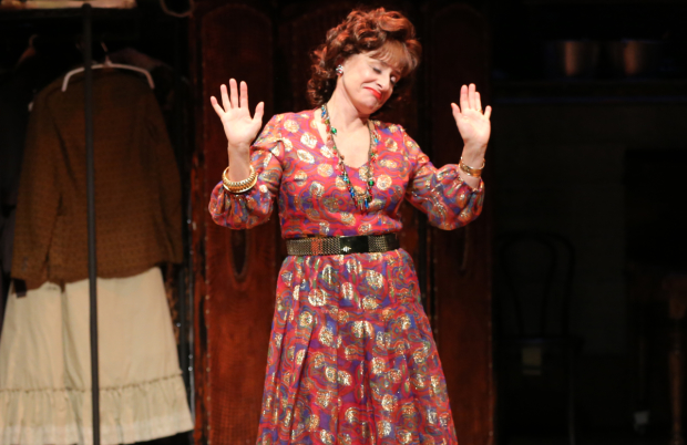 Patti LuPone throws up her hands (in a scene from Shows for Days.