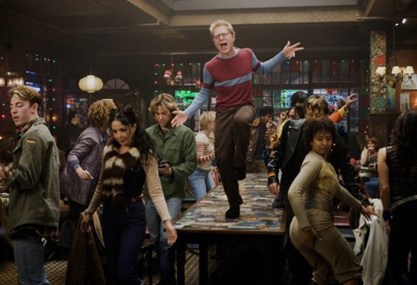 Original Broadway cast member Anthony Rapp (center) and the cast of the 2005 film version of Rent.