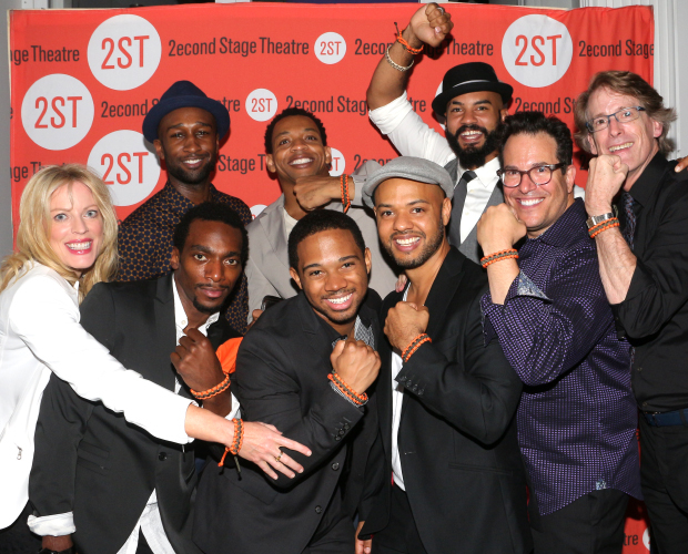 Sherie Rene Scott (left) and the team behind Whorl Inside a Loop show off their new opening-night bracelets.