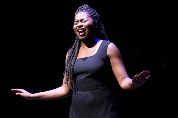 2015 Jimmy Award winner Marla Louissaint sings onstage at the Minskoff Theatre.