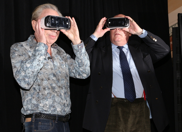 School of Rock creators Andrew Lloyd Webber and Julian Fellowes watch their new music video on a special viewing device.