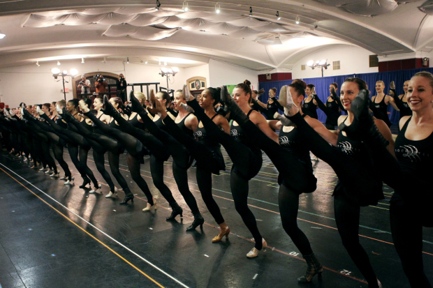 The Rockettes rehearse their famous kick-line.