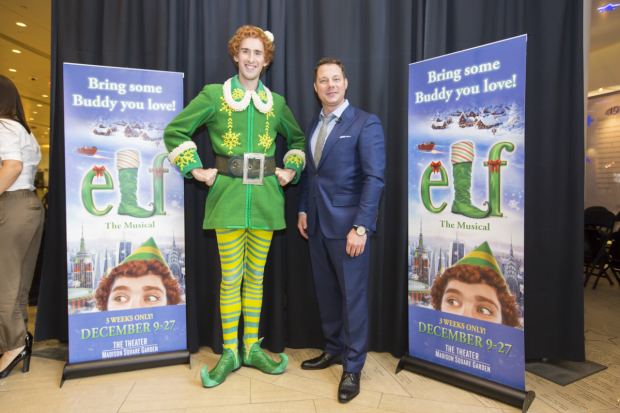 Buddy The Elf joins radio host John Foxx for a photo kicking off the holiday season.