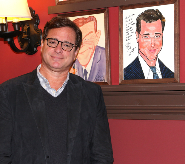 Bob Saget poses for a photo alongside his Sardi&#39;s caricature.