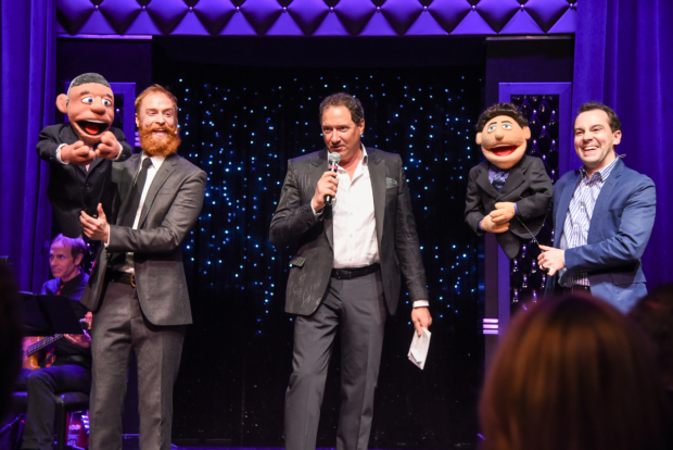 Avenue Q producer Kevin McCollum (center) is feted with former cast members Rob Morrison (left), Rob McClure (right),  and puppet friends.