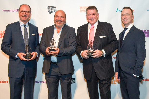 Honorees Martin Grant, Casey Nicholaw, and Darren P. DeVerna, join NYMF Execitove Director Dan Markley for a photo.