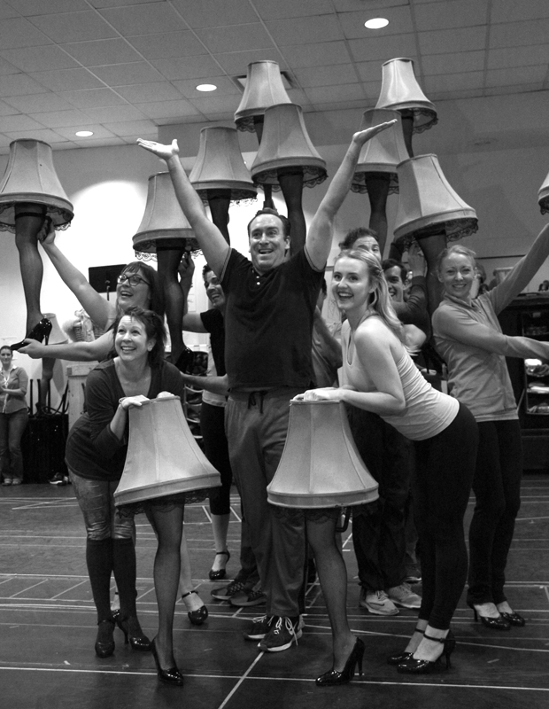 Chris Hoch leads Paper Mill Playhouse cast of A Christmas Story in a Leg Lamp kick-line.
