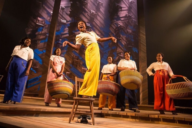 Cynthia Erivo (center) and the company of The Color Purple, directed by John Doyle at the Bernard B. Jacobs Theatre.