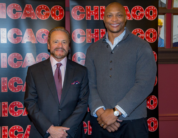 Eddie George poses for photos with longtime Chicago producer Barry Weissler.