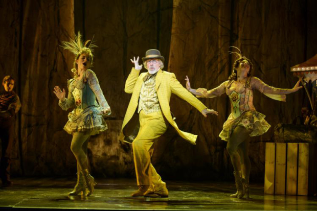 Terrence Mann (center) plays the man in the yellow suit in Tuck Everlasting, directed by Casey Nicholaw, at the Broadhurst Theatre.