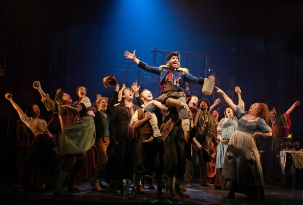Gavin Lee and the ensemble in a scene from the new Broadway production of Les Misérables at the Imperial Theatre.
