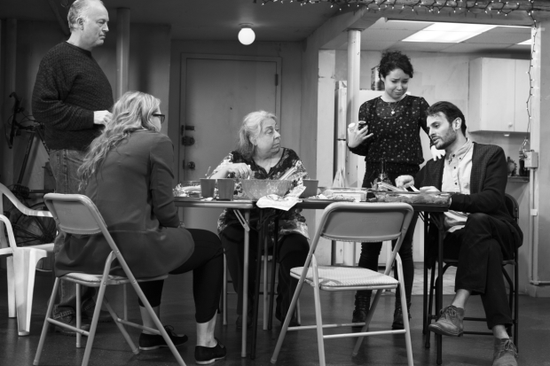 Erik (Reed Birney), Aimee (Cassie Beck), Deirdre (Jayne Houdyshell), and Brigid (Sarah Steele) listen as Rich (Arian Moayed) explains his trust fund in The Humans.