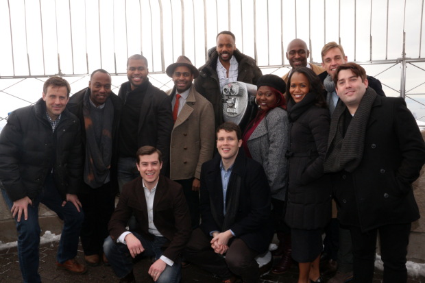 The company of The Book Of Mormon heads up to the top of the Empire State Building.