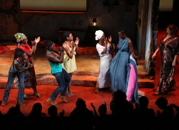 The cast cheers as playwright Danai Gurira and director Liesl Tommy join them on stage.
