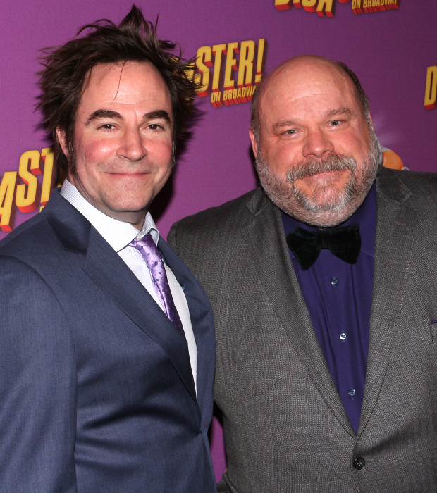 Cast members Roger Bart and Kevin Chamberlin take a photo together.