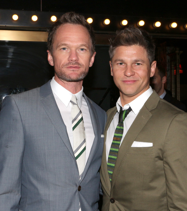 Neil Patrick Harris and David Burtka pose for photos as they arrive at Studio 54.