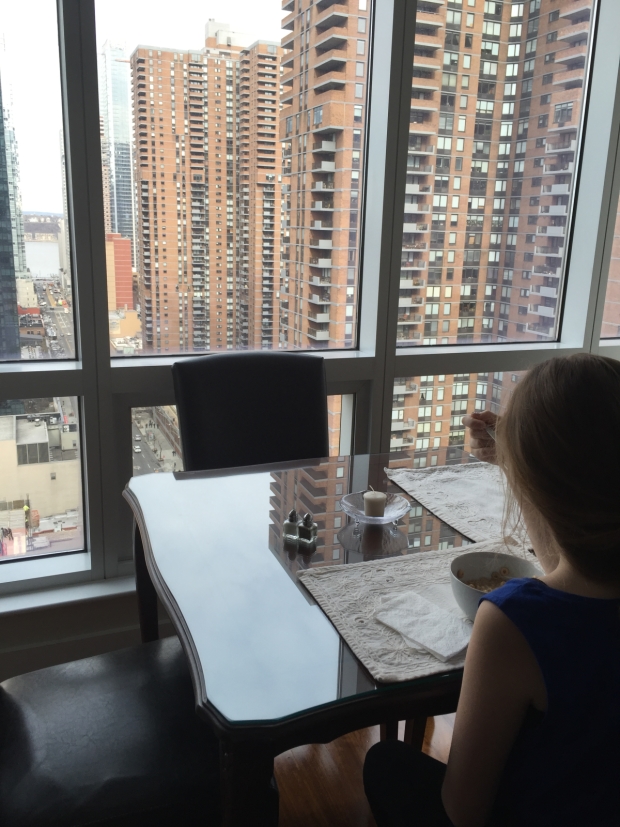 Breakfast Cheerios at our apartment! The window looks west towards the Hudson.