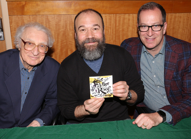Danny Burstein shows off a signed Fiddler on the Roof CD booklet alongside lyricist Sheldon Harnick (left) and musical director Ted Sperling (right).