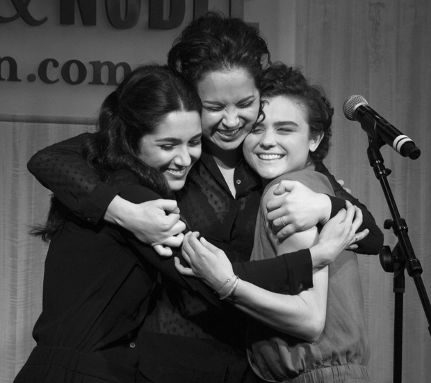 Fiddler sisters Samantha Massell, Alexandra Silber, and Melanie Moore give each other a big hug.