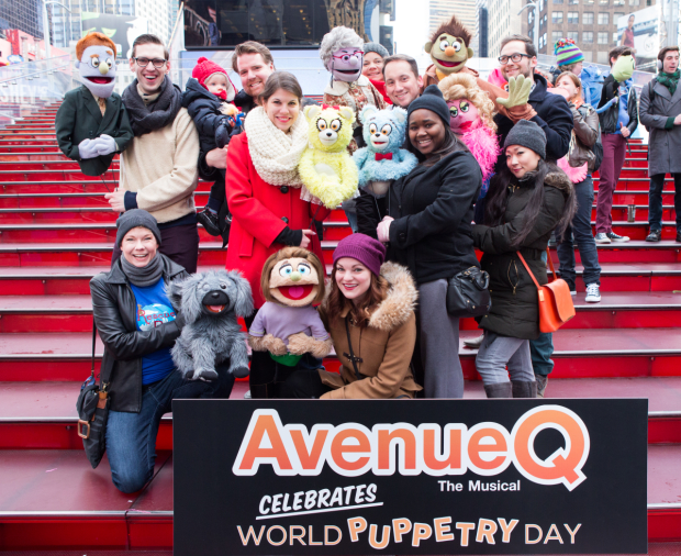 The human and puppet cast of Avenue Q celebrates World Puppetry Day.
