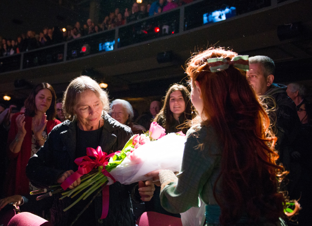 Tuck Everlasting star Sarah Charles Lewis presents Natalie Babbitt with a bouquet of flowers.