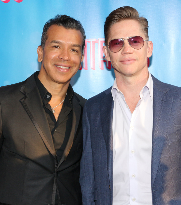 On Your Feet! choreographer Sergio Trujillo and his partner, Jack Noseworthy, head into the Brooks Atkinson Theatre.