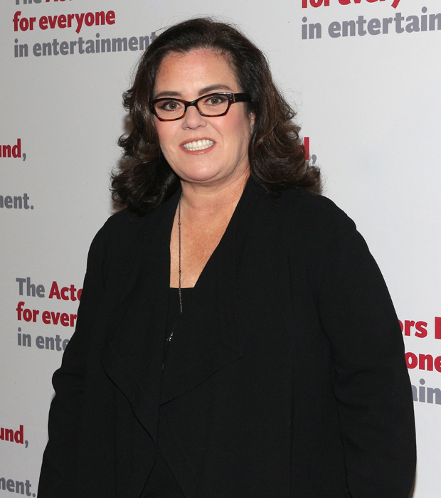 Rosie O&#39;Donnell poses for photos as she arrives for the Actors Fund gala.
