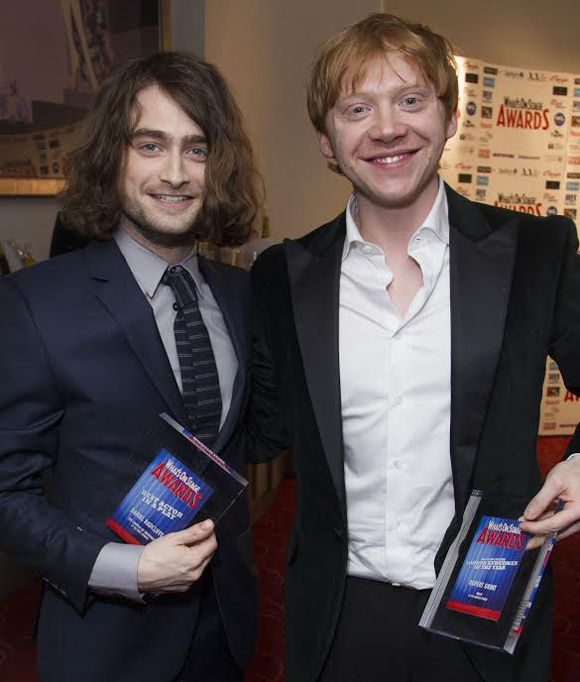 Harry Potter stars Daniel Radcliffe and Rupert Grint show off their 2014 WhatsOnStage Awards for The Cripple of Inishmaan and Mojo, respectively.