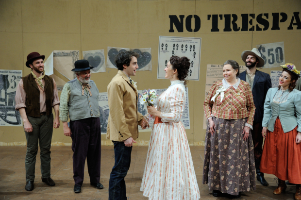 Charlie Thurston as Curly and Rachael Warren as Laurey (center) with the cast of Rodgers and Hammerstein's Oklahoma!, directed and choreographed by Richard and Sharon Jenkins, at Trinity Rep.
