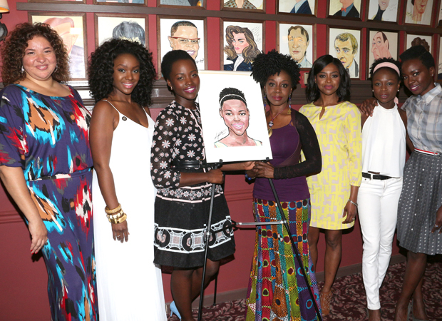 Lupita Nyong&#39;o and her caricature are flanked by Eclipsed director Liesl Tommy, cast members Saycon Sengbloh, Akuosa Busia, Pascale Armand, Zainab Jah, and playwright Danai Gurira.