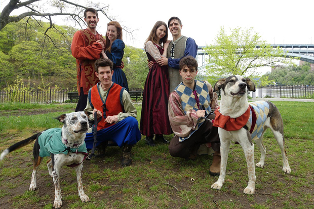 The company of The Two Gentlemen of Verona takes the dogs for a walk in Inwood Hill Park.