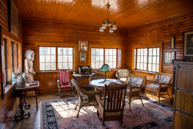 Monte Cristo Cottage&#39;s living room inspired O&#39;Neill with the setting for his most intimate play. The room is, in fact, a converted schoolhouse. In the back-left corner can be seen a costume worn by Colleen Dewhurst in the 1988 Yale Rep centennial production of Long Days Journey Into Night.
