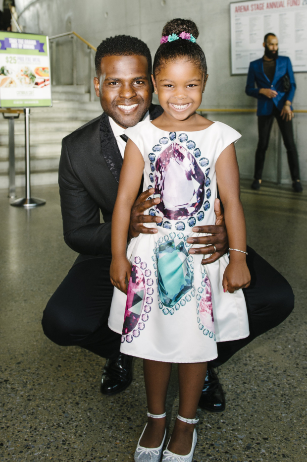 Juan Winans, who stars in the title role, smiles for a photo with his daughter.